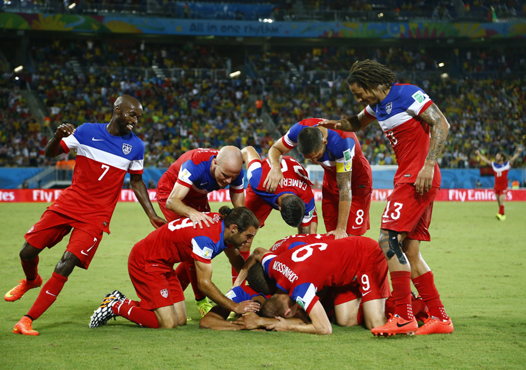 Team U.S.A celebrate during the 2014 World Cup Group G soccer match between Ghana and the U.S. at the Dunas arena