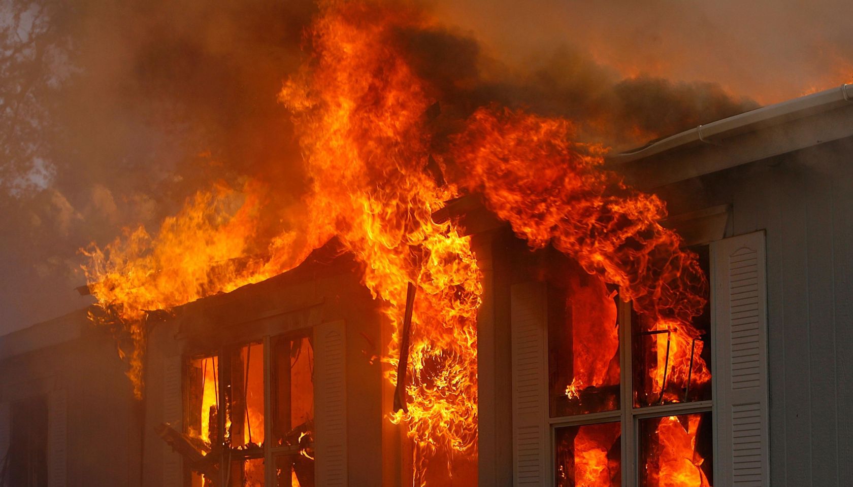 Santa Ana Winds Stoke Wildfires In Southern California