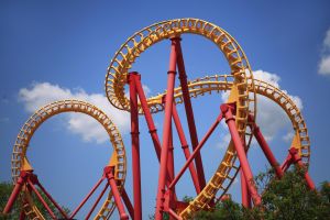 A Colorful Looping Roller Coaster On A Beautiful Sunny Day