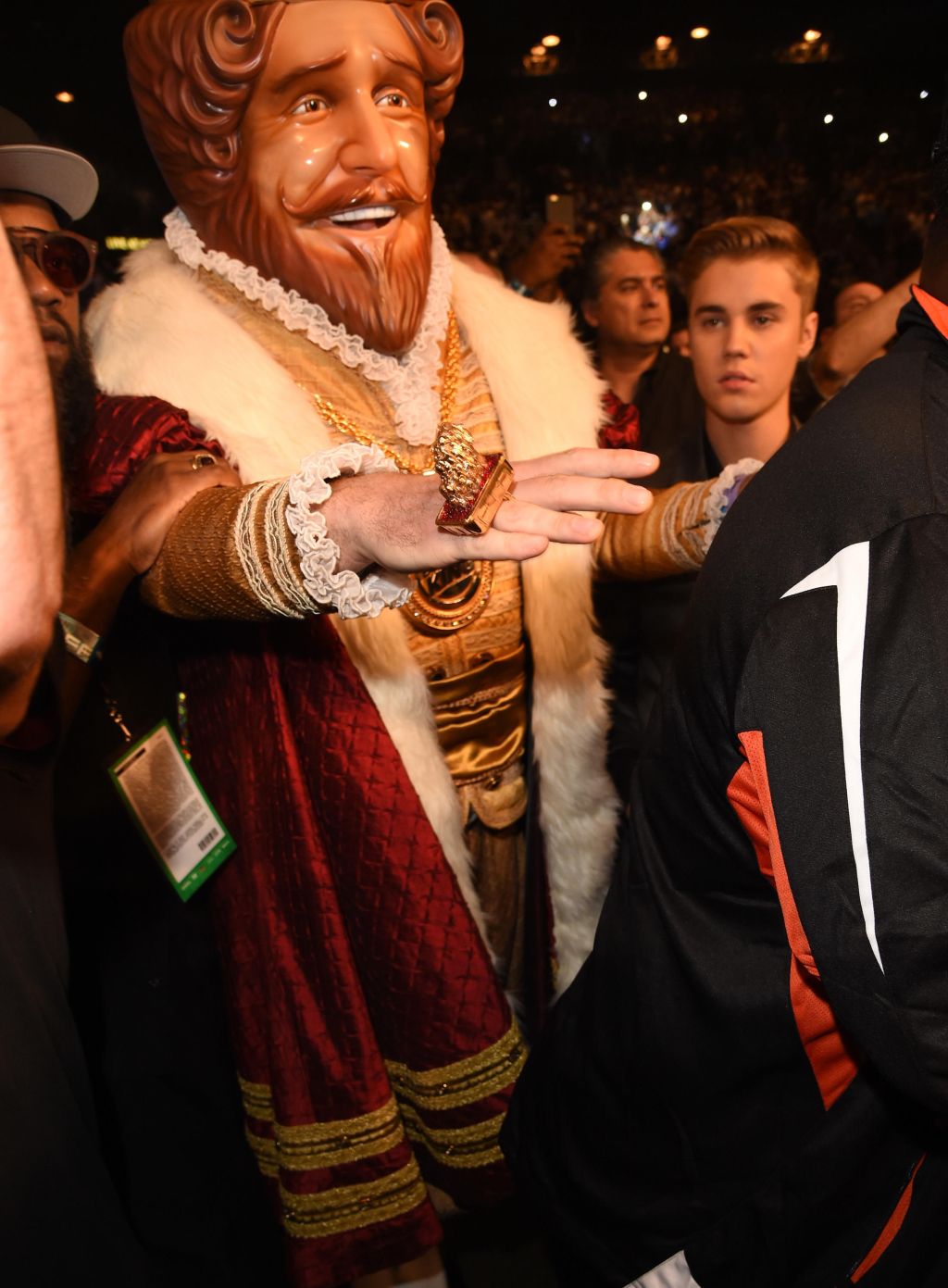 The Burger King & Justin Bieber walk alongside Floyd Mayweather as he enters MGM Arena in Las Vegas