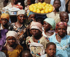 Nigeria,group of children in market girls wearing colourful headscarfs