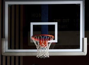 A young man playing basketball