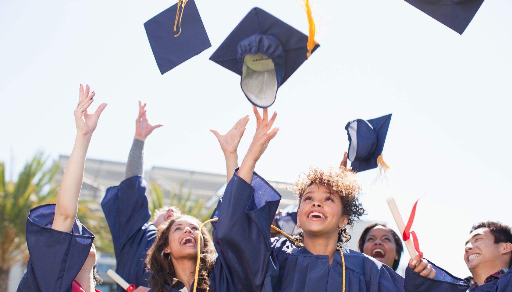 Graduates Throwing Caps
