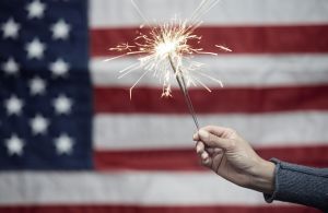 Sparkler in front of American flag