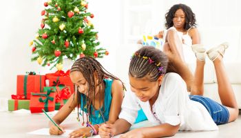 Children Drawing and Coloring to Santa Claus.