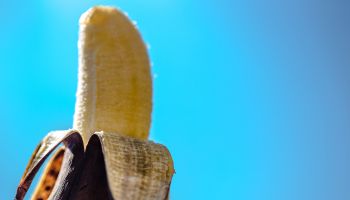 Close-Up Of Banana Against Clear Blue Sky