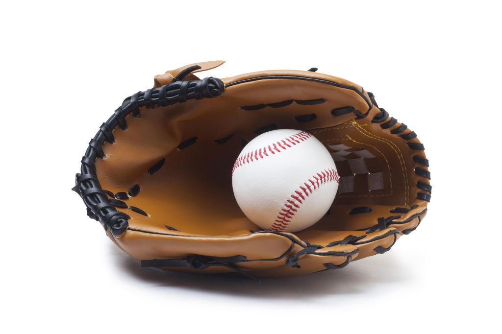 Baseball glove and ball isolated on white background.