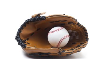 Baseball glove and ball isolated on white background.