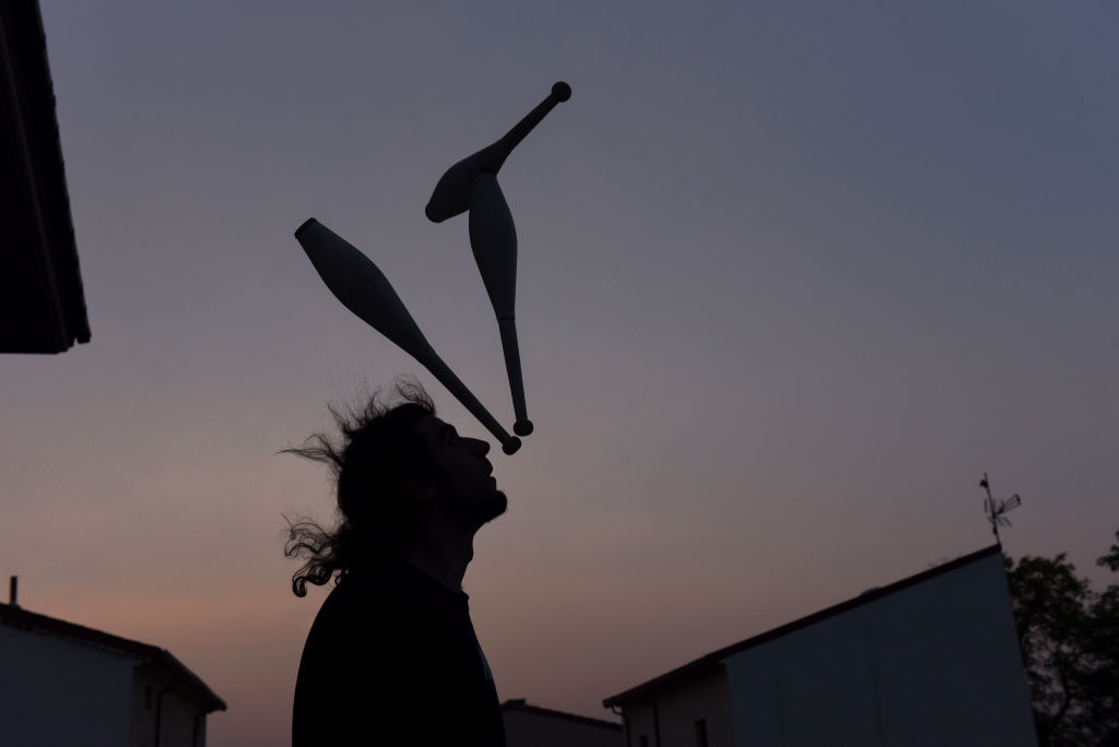A man juggles at dusk in Rebollo de Duero, northeastern...