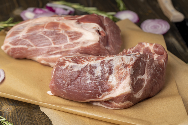 a sliced piece of pork meat from the neck