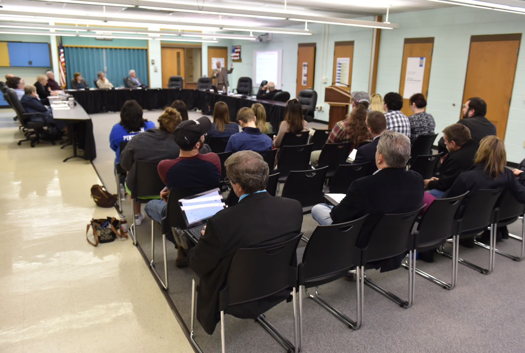 Reading's Ethan Cox (28) tries to move the puck past Cincinnati's Michael Pelech (23).ECHL Hockey, the Cincinnati Cyclones vs the Reading Royals at the Sovereign Center in Reading Friday night for Game 1 of the Eastern Conference finals.