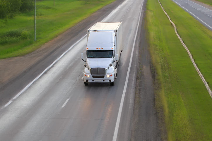 Big Truck moving on country highway.