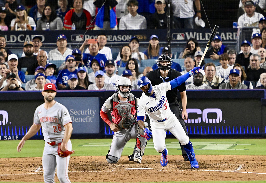 Los Angeles Dodgers defeated the Cincinnati Reds 8-4 to win game 2 of a wild card series baseball game and advance to the NLDS.