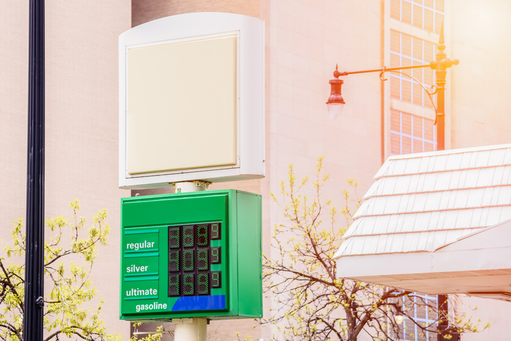 Gas station price sign in a residential area