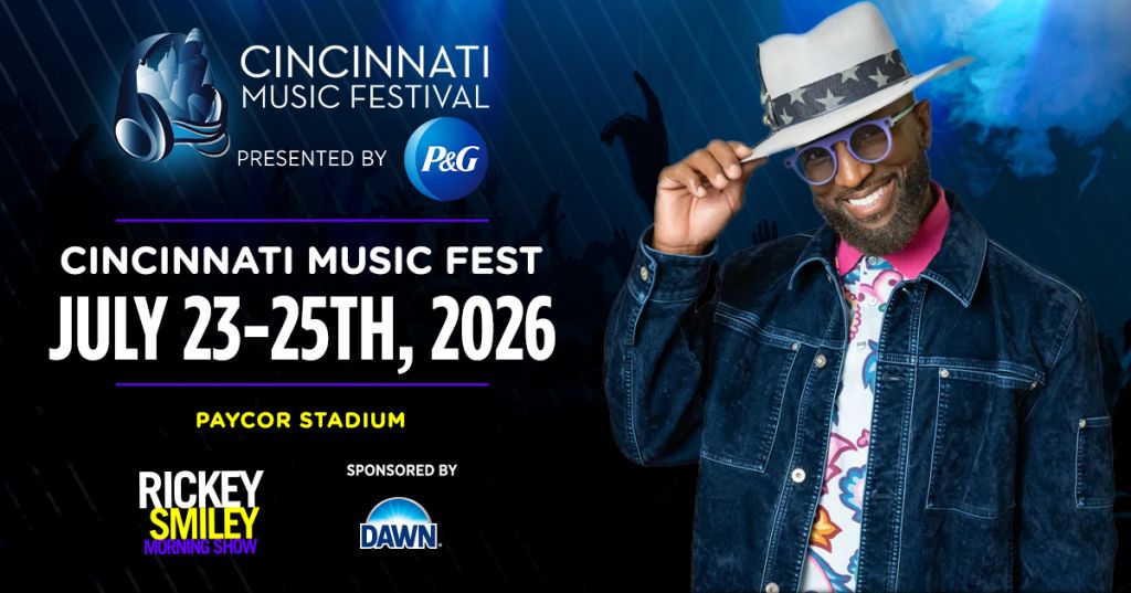 A man wearing a denim jacket, sunglasses, and a white hat with stars stands in front of a banner for the Cincinnati Music Festival presented by P&G, scheduled for July 23-25, 2026 at Paycor Stadium.
